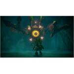 A brave character in green armor faces a massive, yellow-eyed mechanical creature with glowing pink triangles on its sides in a dark, misty cavern.